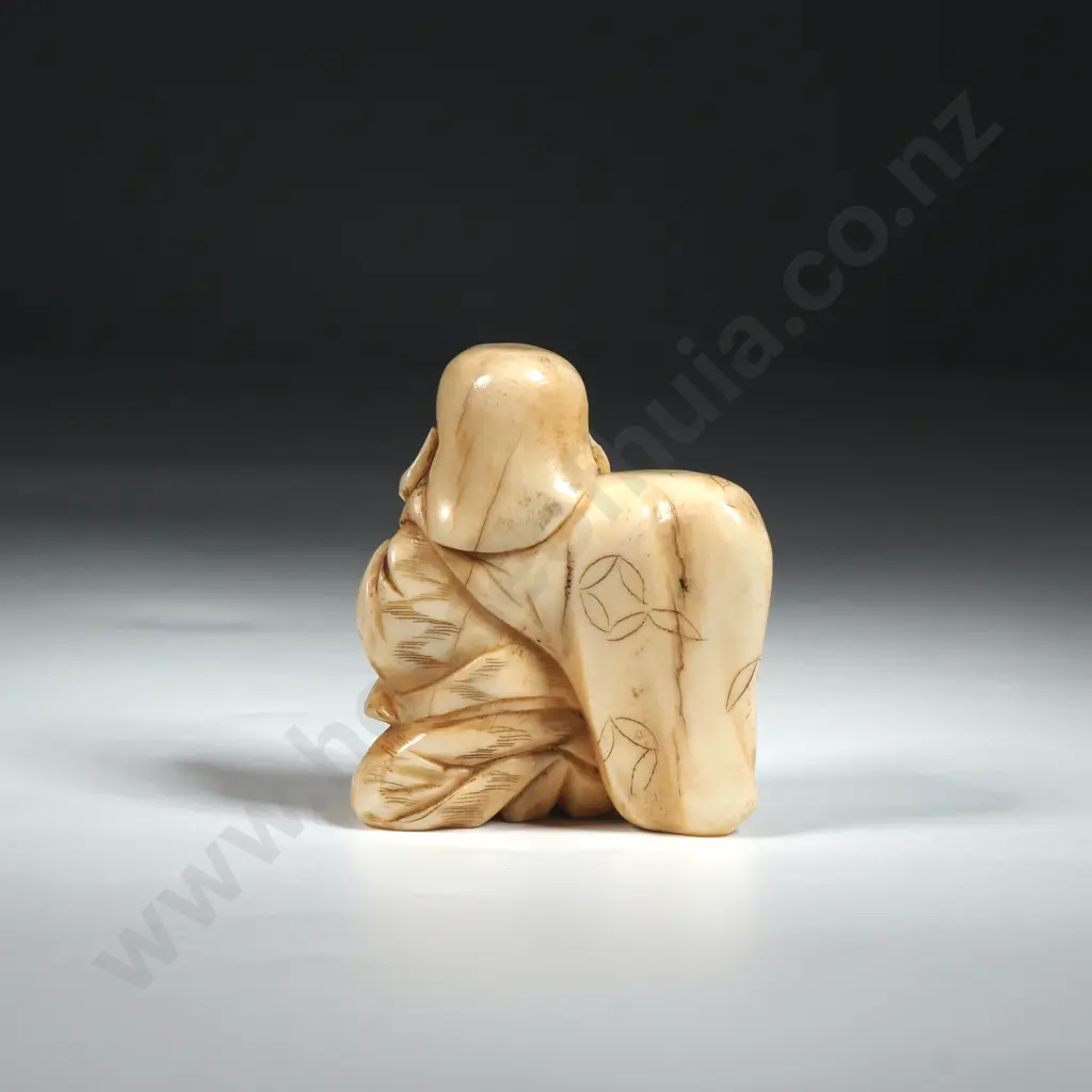 Ivory Okimono Depicting a Man with Sack & Holding a Rod Image 1++