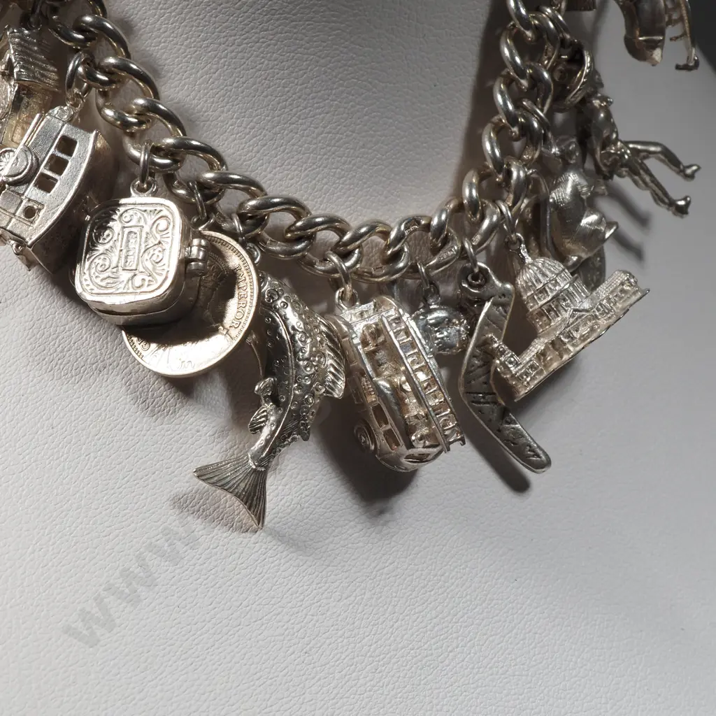 Exceptional Sterling Silver Charm Bracelet w 18 Charms incl Moari Whare Image 1++