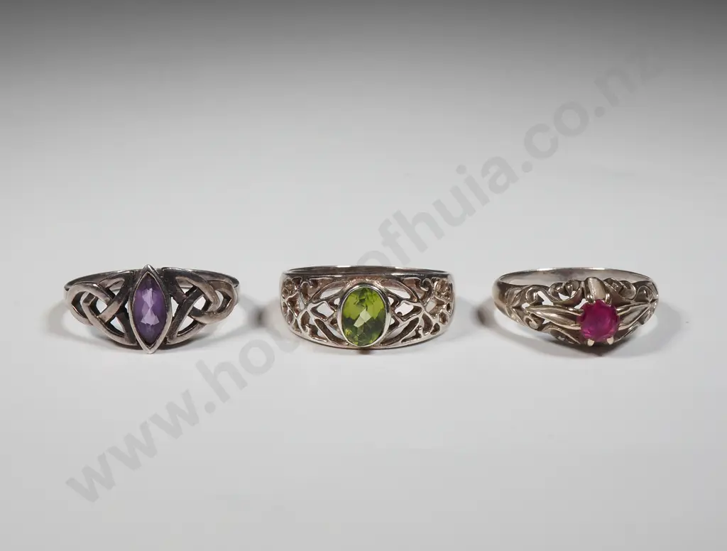 Three Sterling Silver Rings: Silver Ring With Red Stone, Celtic Ring with Purple Ring & A Ring With Green Stone Image 1++