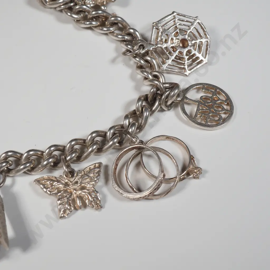 Vintage Sterling Silver Charm Bracelet with A Variety Of Charms Including A Sewing Machine, Spider's Web,Engagement Ring Image 1++