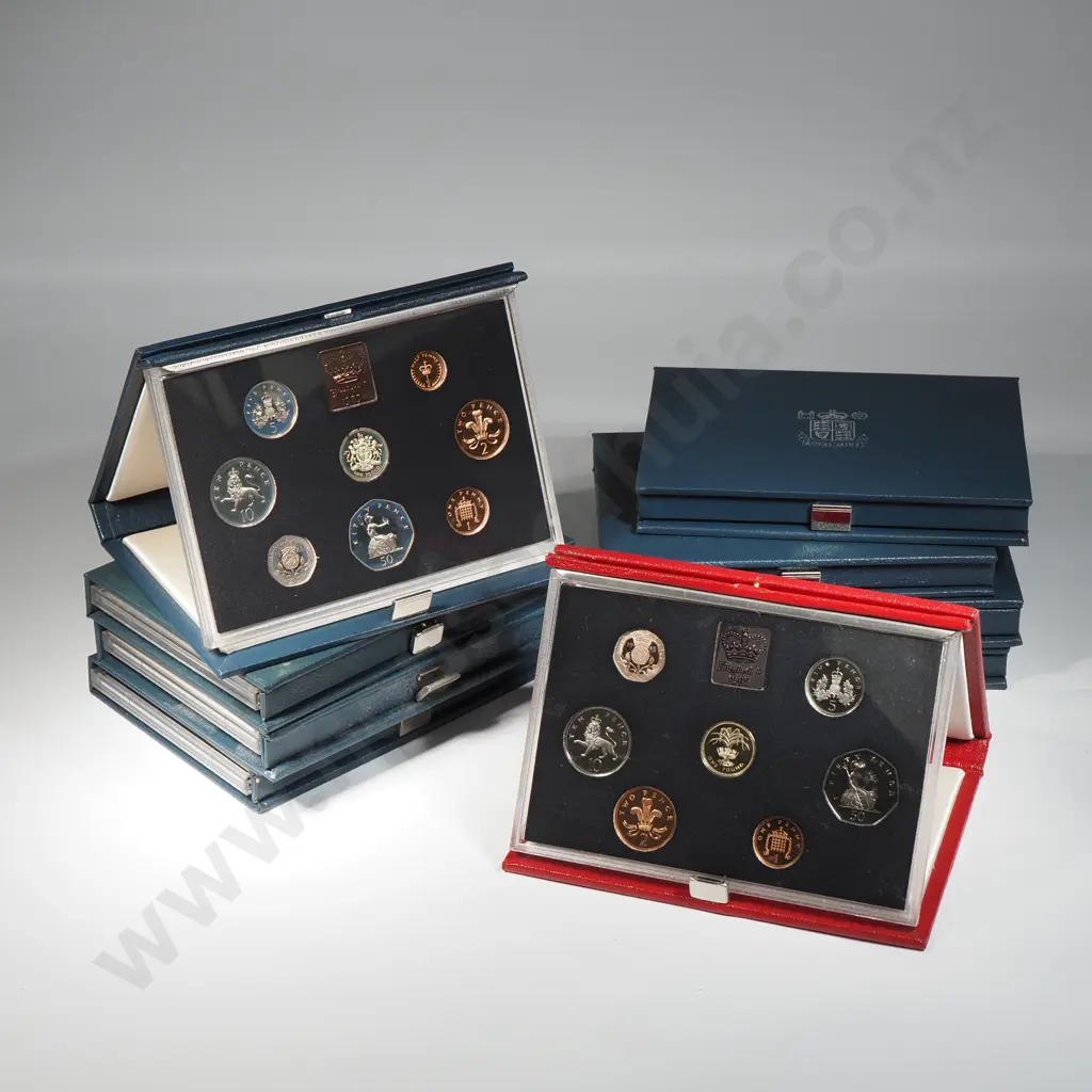 9 x UK proof coin sets dated 1983 x 3, 1984 x 2, 1985, 1985 red leather case Combined C.V. 174 pounds ( NZD $400 Image 1++