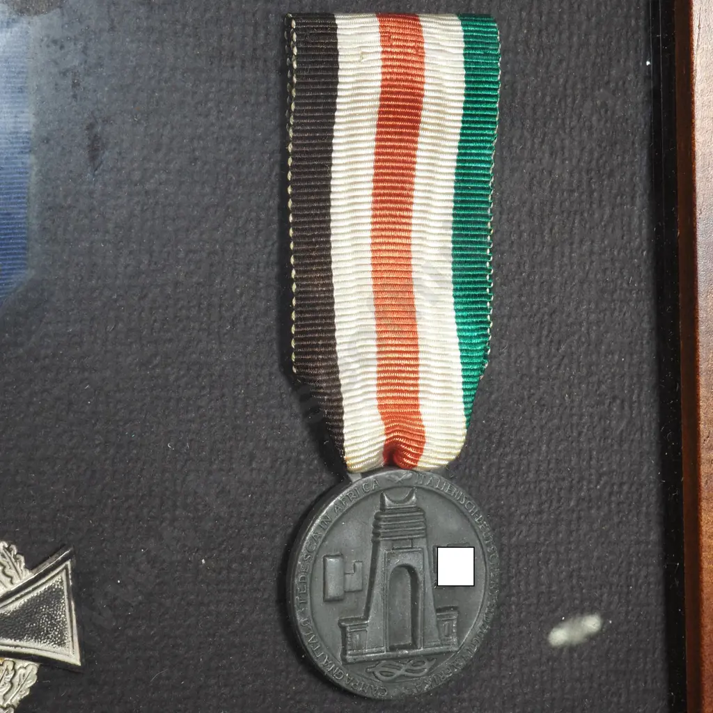 Four WW2 German Medals in Wooden Frame Image 1++