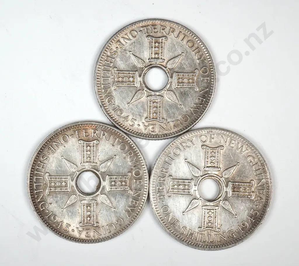 Three 1945 Territory of New Guinea One Shilling Coins  - Better Grades  Image 1++