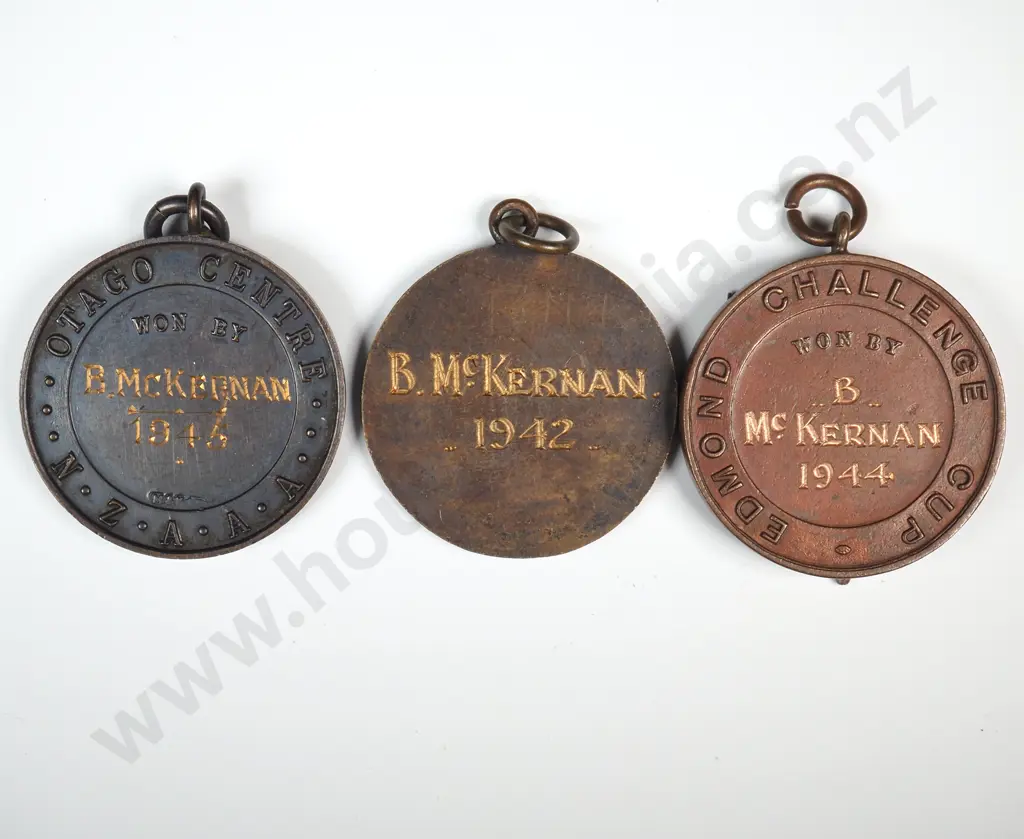 3 x different copper and bronze Otago running prize fob medals, won by “B. MCKERNAN” 1942, 1944 and 1945 Image 1++