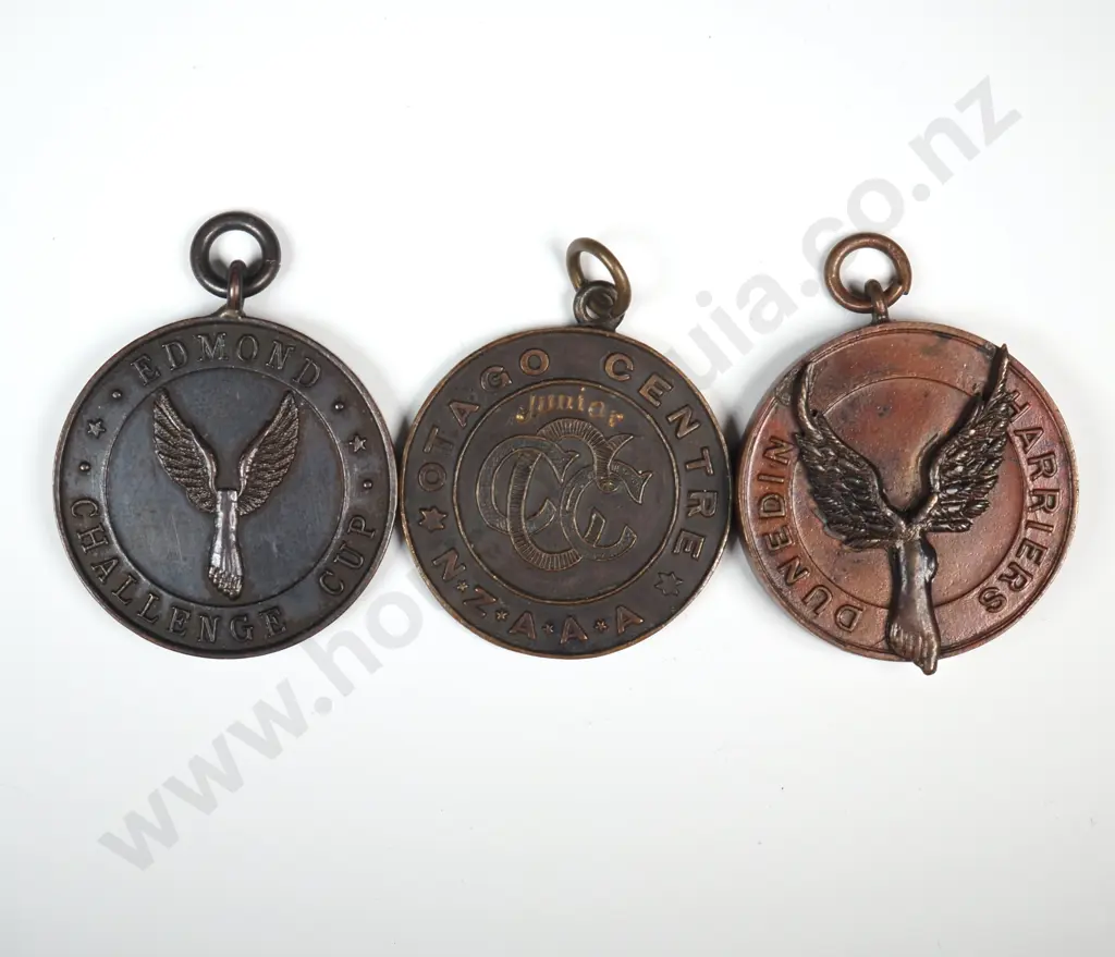 3 x different copper and bronze Otago running prize fob medals, won by “B. MCKERNAN” 1942, 1944 and 1945 Image 1++