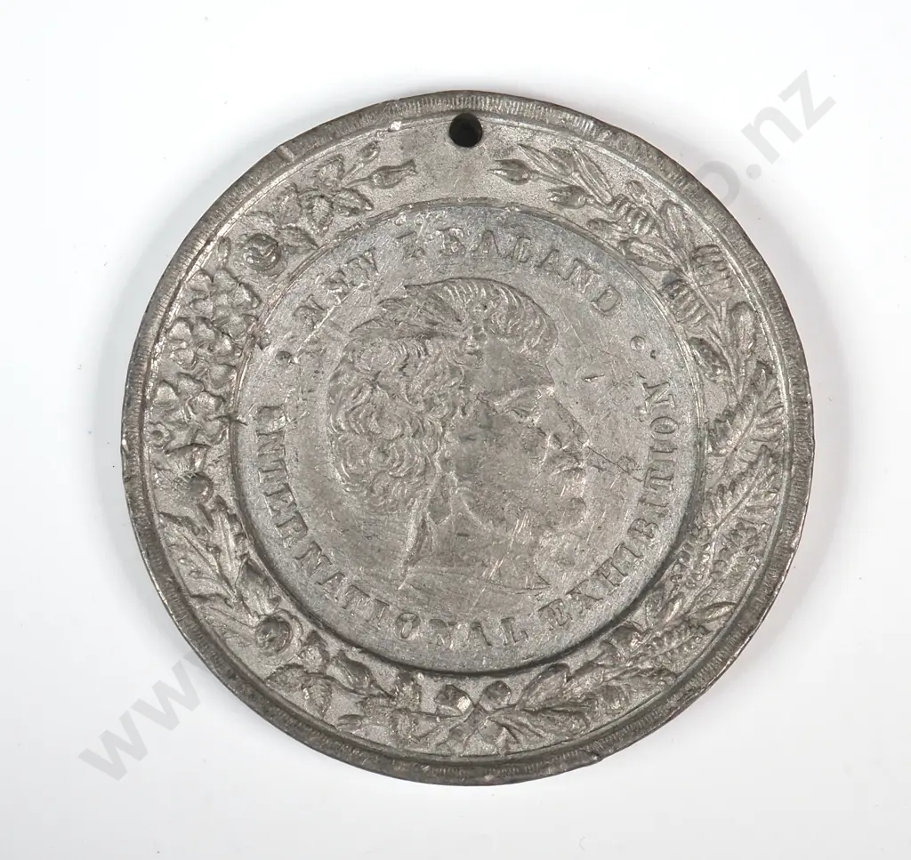 White metal medal struck for the Industrial Exhibition held in Christchurch in 1882. 38.5mm. It is listed in the Medallic Commemoratives of New Zealand 1865-1940 by Leon Morel as number 1882/21 Image 1++