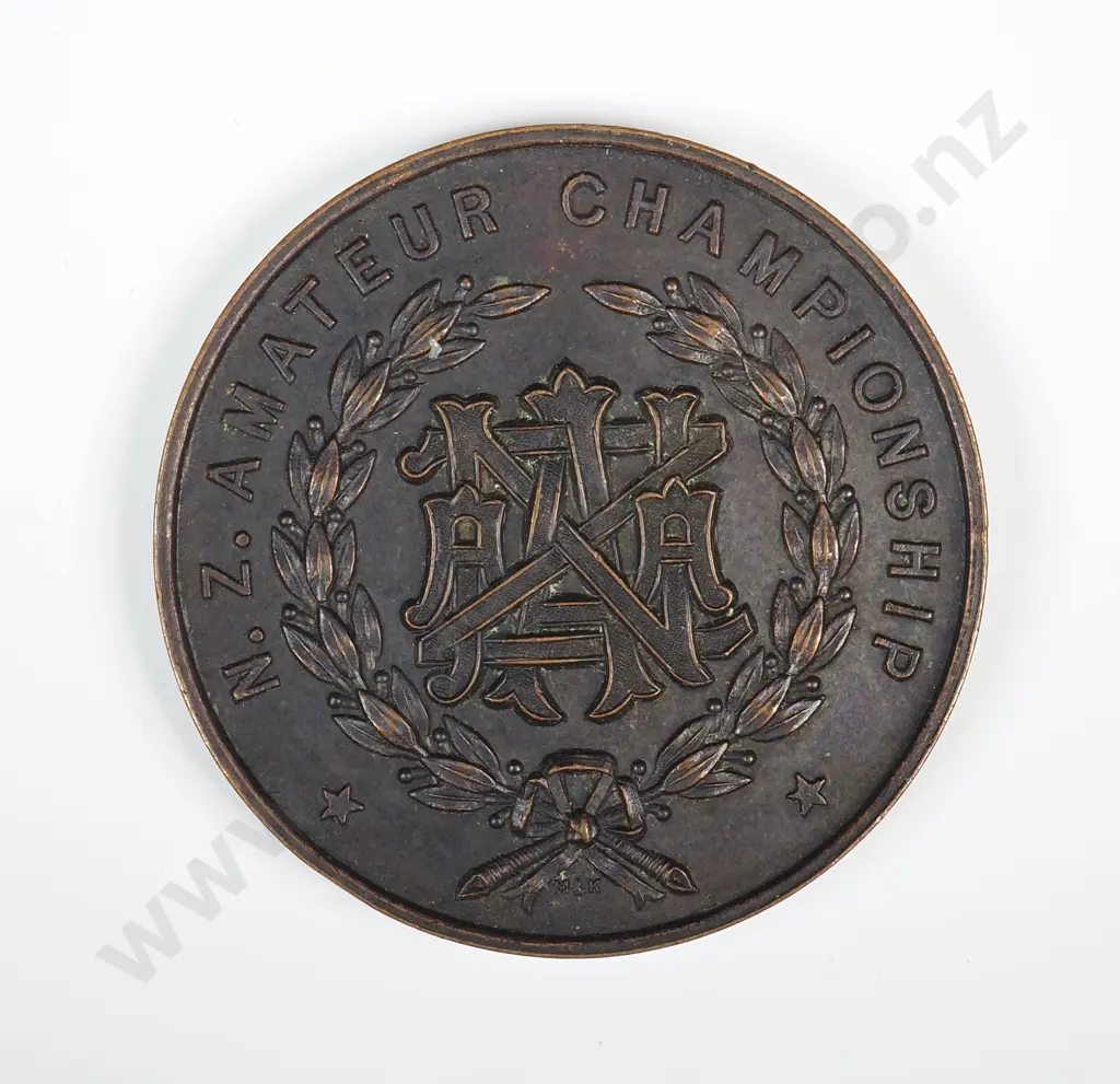 Copper medal “NZAAA / N.Z. AMATEUR CHAMPIONSHIP”, engraved “1961 / CHRISTCHURCH / 1ST / LONG JUMP / E. J. THOMSON (0) / 20’ 8 ¼ “”, 40mm Image 1++