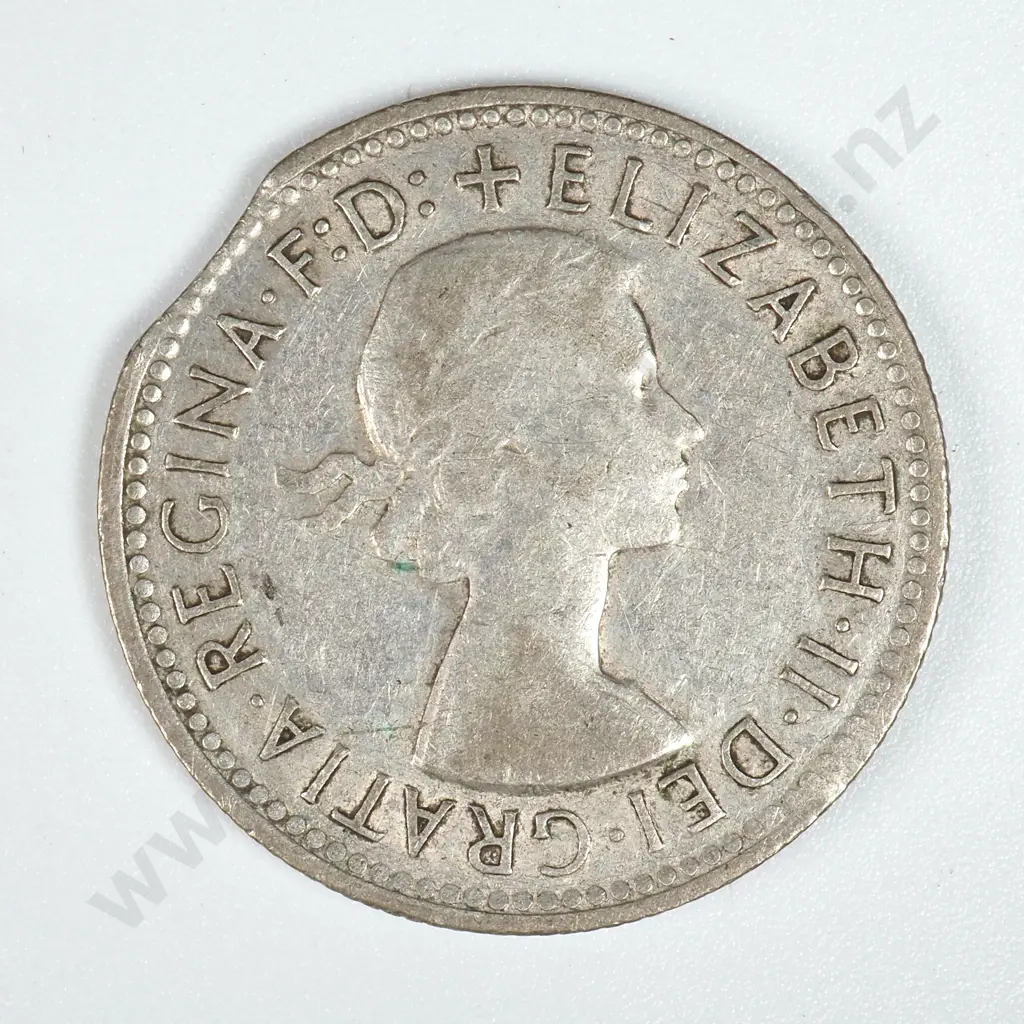 1960 Australian Shilling - Clipped Planchet  Image 1++