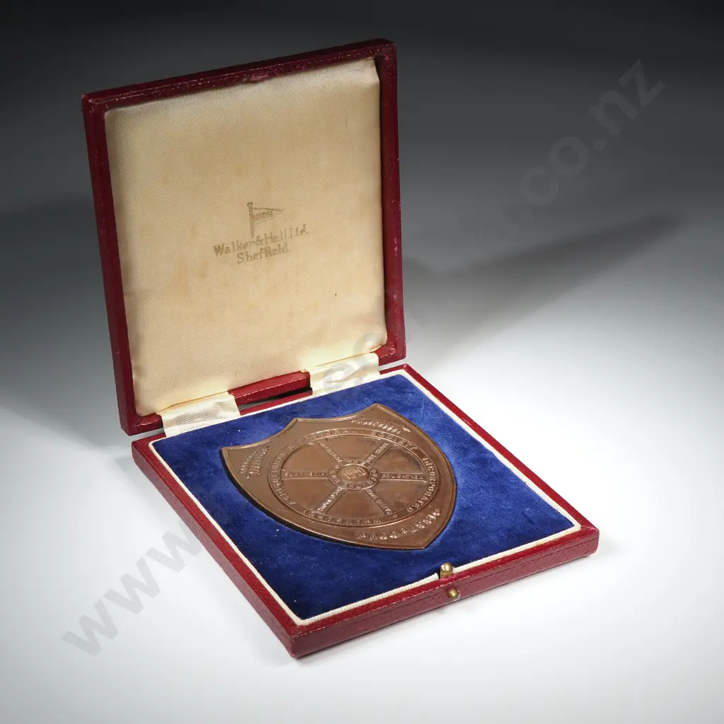 Cased copper prize fob medal, on the front “WHANGAREI AGRICULTURAL & PASTORAL SOCIETY INCORPORATED”, “PROGRESSIO” and “THE HUB OF THE NORTH”, engraved 1940,  the back engraved “MASTER BAKERS / L. FORD”, 76mm x 63mm Image 1++
