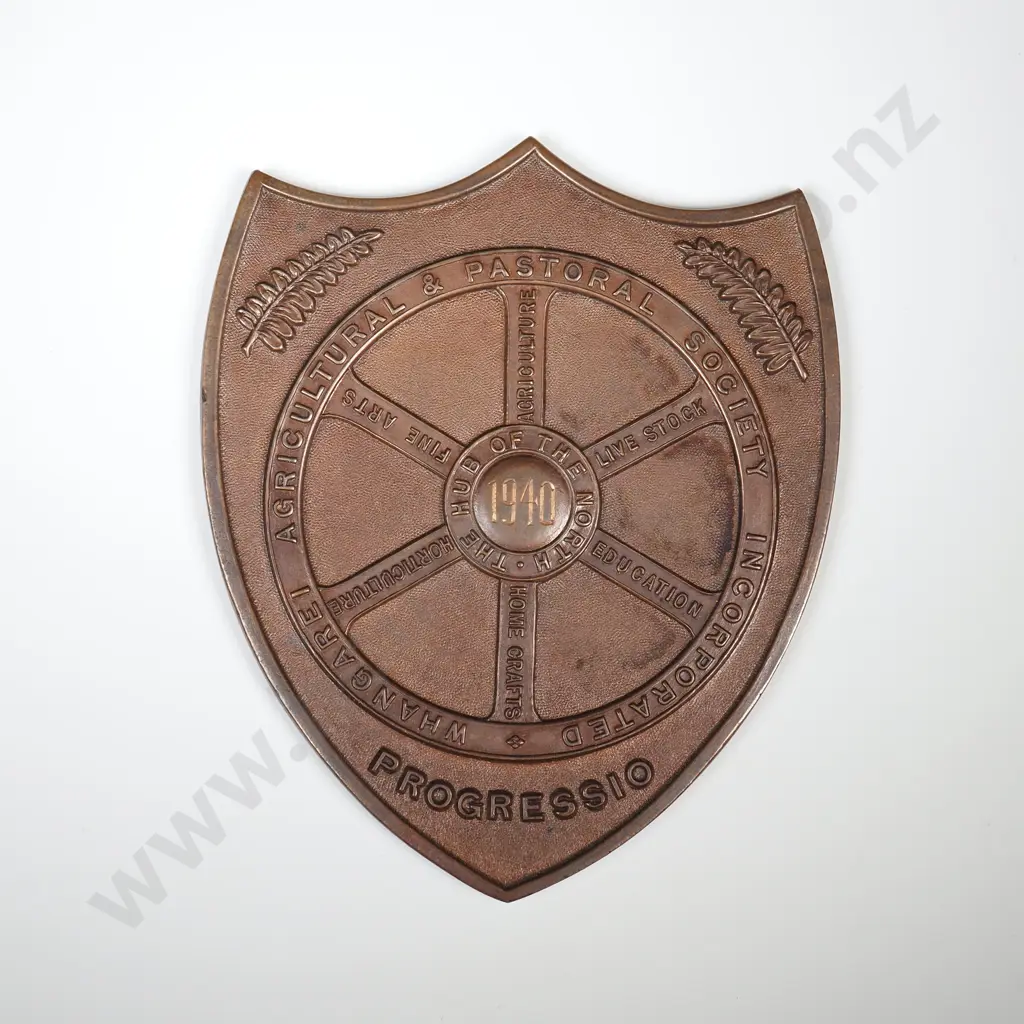 Cased copper prize fob medal, on the front “WHANGAREI AGRICULTURAL & PASTORAL SOCIETY INCORPORATED”, “PROGRESSIO” and “THE HUB OF THE NORTH”, engraved 1940,  the back engraved “MASTER BAKERS / L. FORD”, 76mm x 63mm Image 1++