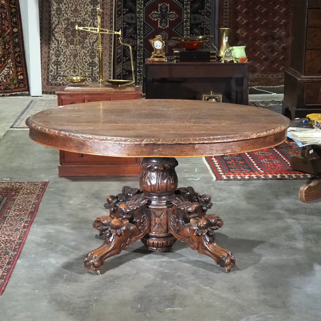 Antique Oval Oak Game/Dining Table w Black Forest Carving to Four Point Base. Four Different Animal Carvings To Base Image 1++
