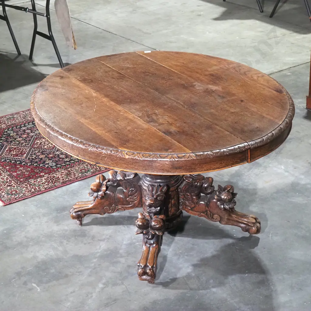 Antique Oval Oak Game/Dining Table w Black Forest Carving to Four Point Base. Four Different Animal Carvings To Base Image 1++