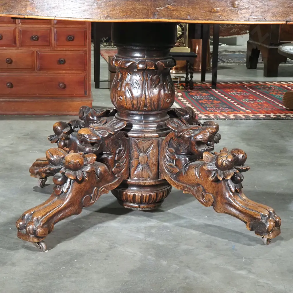 Antique Oval Oak Game/Dining Table w Black Forest Carving to Four Point Base. Four Different Animal Carvings To Base Image 1++