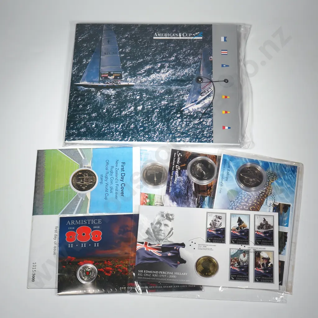 7 X UNC COIN & STAMP COVERS – 2018 ARMISTICE WITH 50 CENTS COIN, 2008 SIR EDMUND HILLARY WITH $1 COIN, 1991 RUGBY WITH $5 COIN, 2002 SKYTOWER WITH $5 COIN, 2002 HECTOR'S DOLPHIN WITH $5 COIN, 2003 GIANT KOKOPU WITH $5 COIN, 2003 AMERICA'S CUP WITH $5 AND $10 COINS IN A PRESENTATION PACK Image 1++