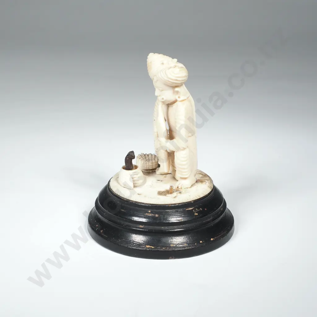 Small Indian Carved Figurine depicting a Snake Charmer w Bronze Coiled Snake in Basket  on an Ebony Base  Image 1++