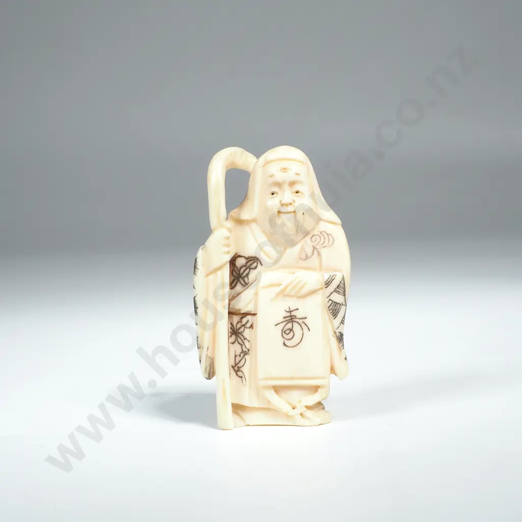 Japanese Carved Ivory Netsuke of a Man Holding A Scroll & Staff Image 1++