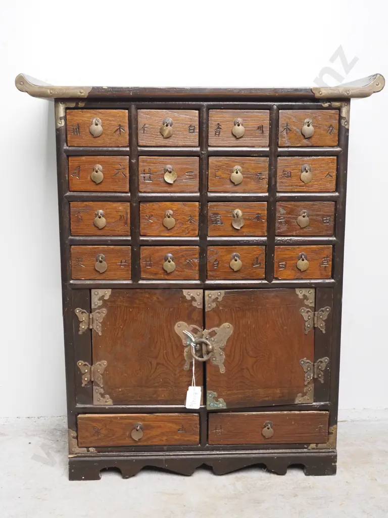Vintage Chinese Wooden Apothecary Chest w Sixteen Small Drawers Arranged Above a Two Door Cabinet w Brass Hardware Image 1++