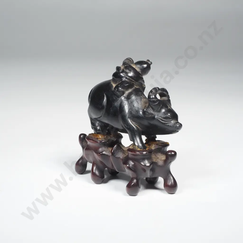 Antique Small Black Jade Carving of a Boy on a Buffalo On a Wooden Stand Image 1++
