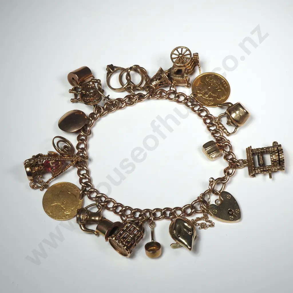 Substantial 9ct Gold Charm Bracelet Image 1++
