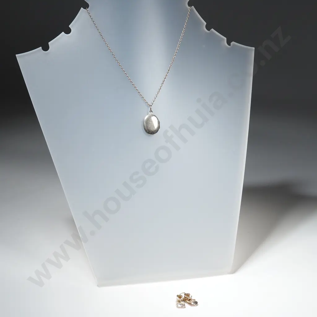 Small Oval Sterling Silver Locket & Chain & Silver Charm in the Form of a Pair of Baby's Shoes Image 1++