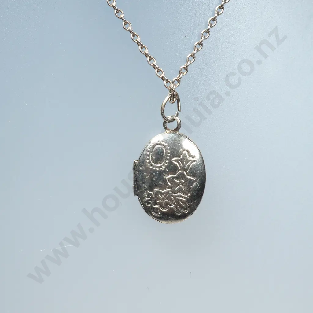 Small Oval Sterling Silver Locket & Chain & Silver Charm in the Form of a Pair of Baby's Shoes Image 1++