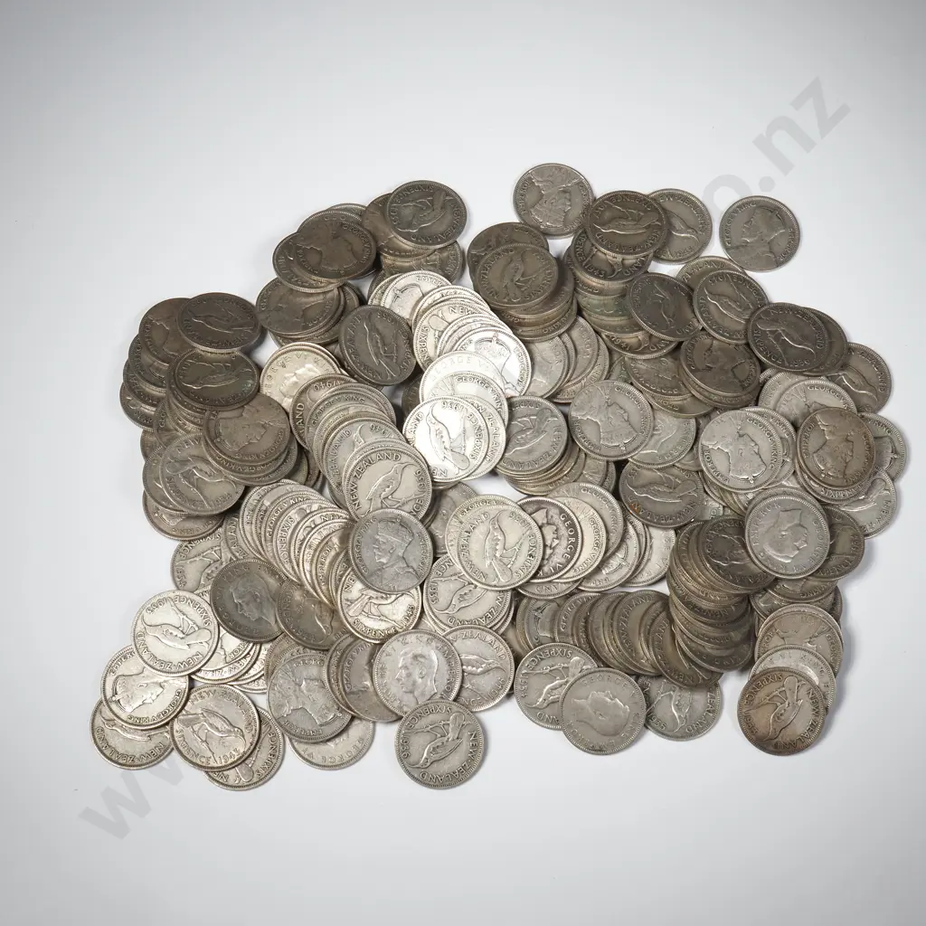 647 Grams of New Zealand 50% Silver Sixpences Image 1++