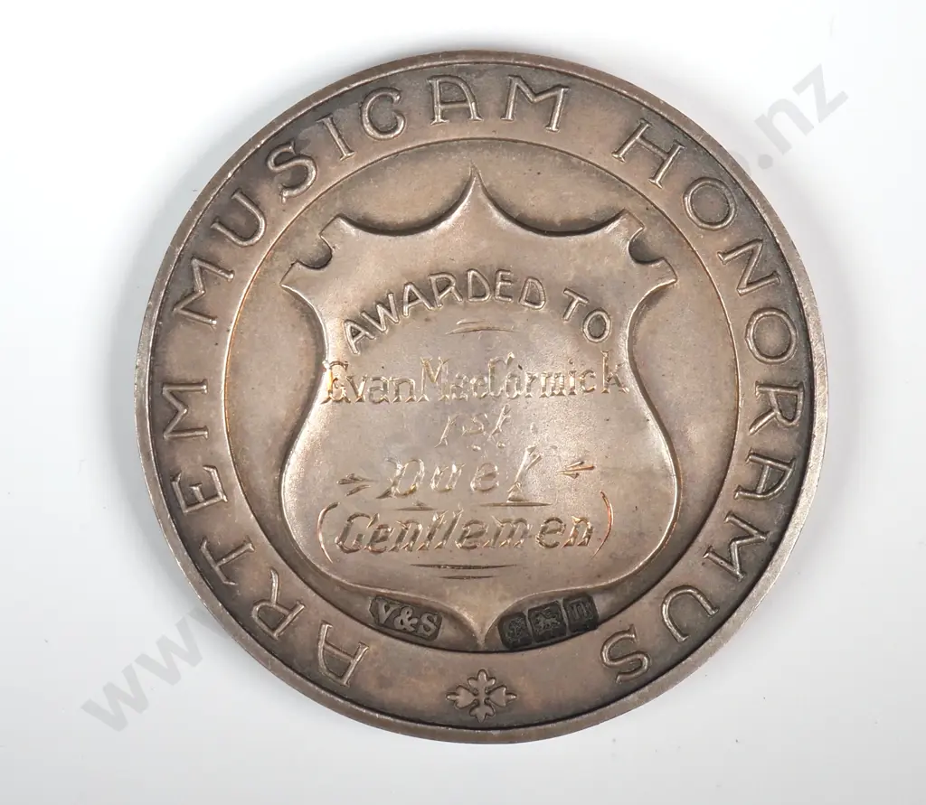 Antique sterling silver medal “AUCKLAND SOCIETY OF MUSICIANS”, “AWARDED TO”, engraved “EVAN MacCORMICK / 1ST / DUET / ( GENTLEMEN )”, 36mm, 29.5 grams, hallmarked Birmingham 1912 Image 1++