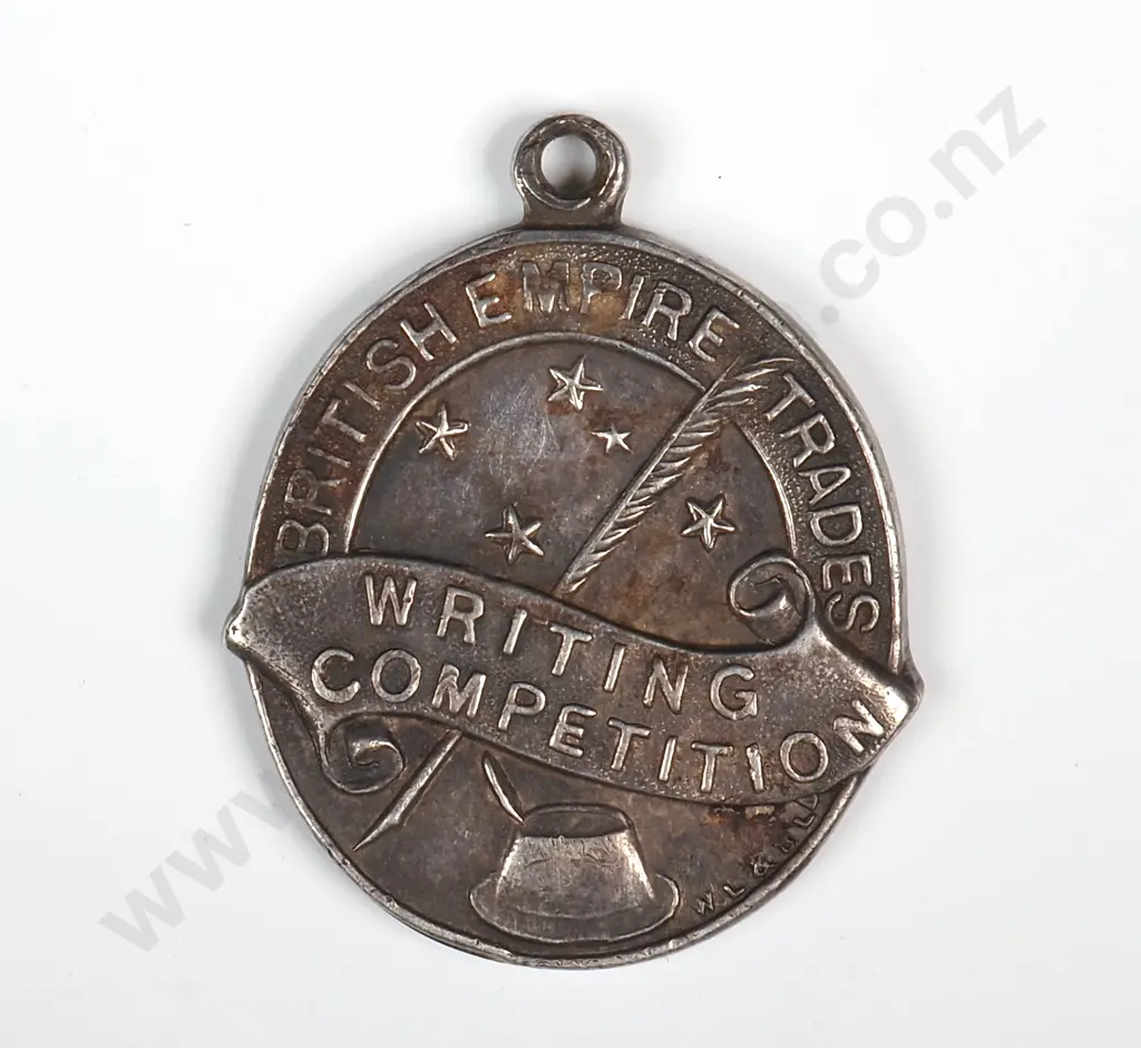 Antique sterling silver medal “BRITISH EMPIRE TRADES / WRITING COMPETITION”, “NEW ZEALAND / SCHOOLS / FIRST PRIZE”, 23mm X 20mm, hallmarked Birmingham 1919 Image 1++
