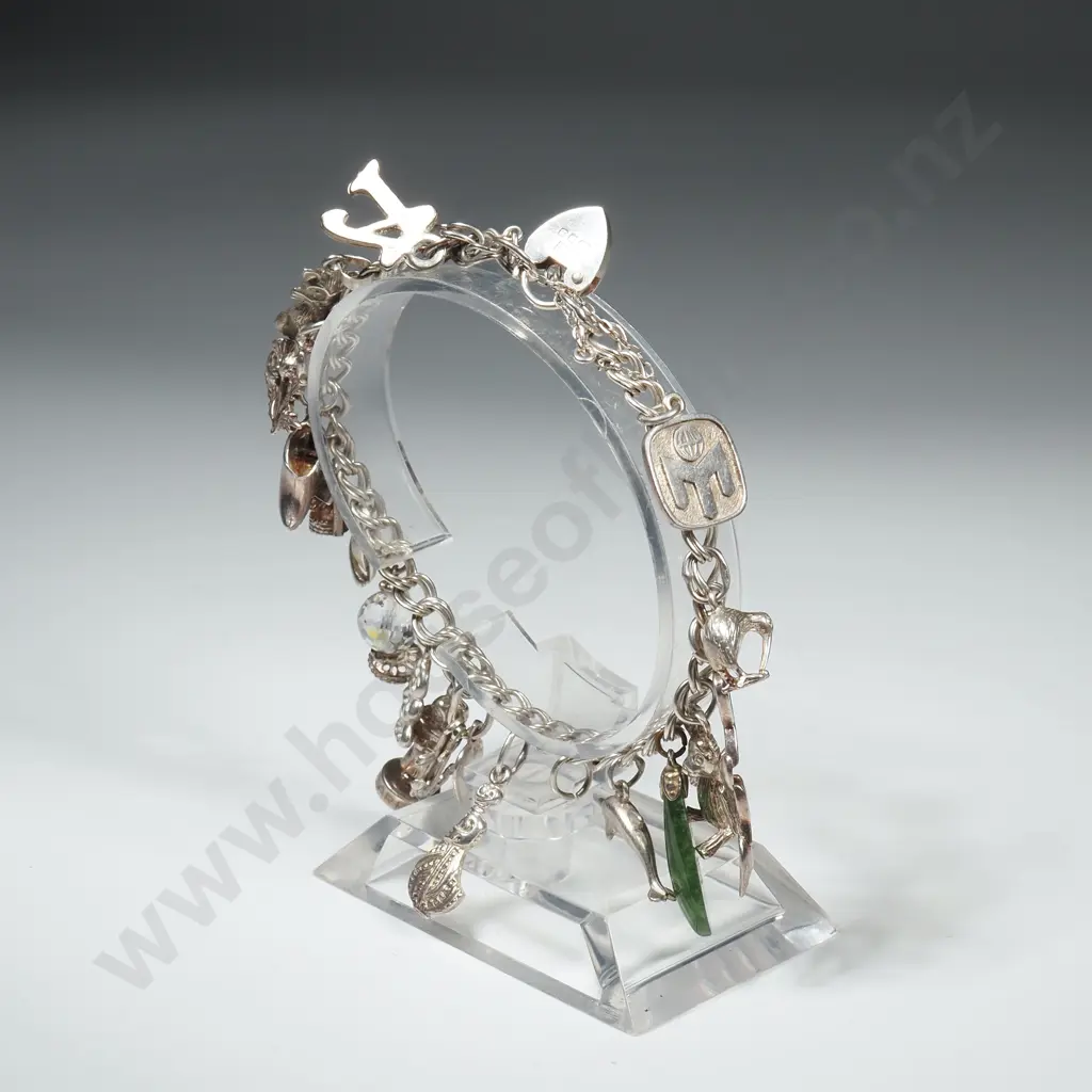 Sterling Silver Charm Bracelet w some NZ Themed Charms Image 1++
