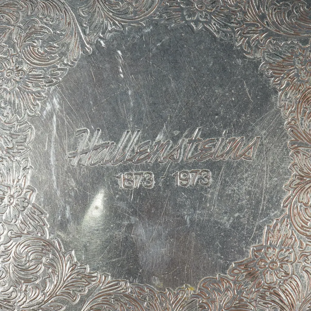 Silver Plated Tray w Engraved Decoration & Embossed Rim Inscribed ' Hallensteins 1873 -1973 Image 1++