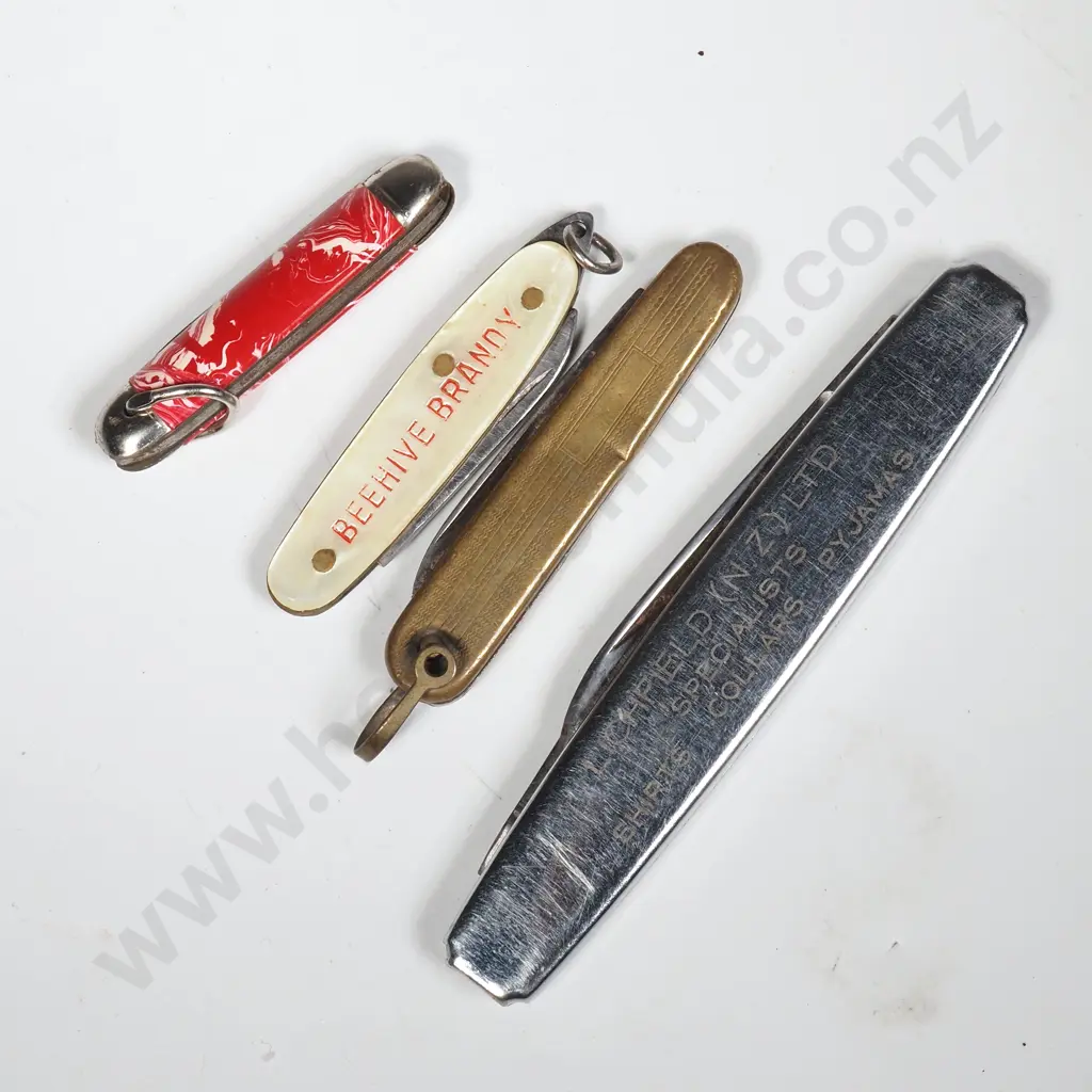 Four Small Pocket Knives including Two Advertising Knives; Beehive Brandy & LIchfield Shirts Image 1++