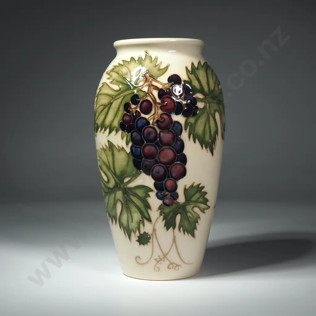 Moorcroft Pottery Grapevine Vase Designed by Sally Tuffin Featuring Purple Grapes on a Cream Coloured Ground Image 1++