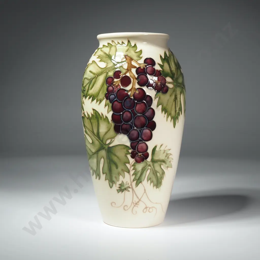 Moorcroft Pottery Grapevine Vase Designed by Sally Tuffin Featuring Purple Grapes on a Cream Coloured Ground Image 1++
