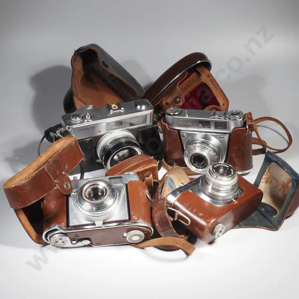 Four Vintage Cameras in Cases Image 1++