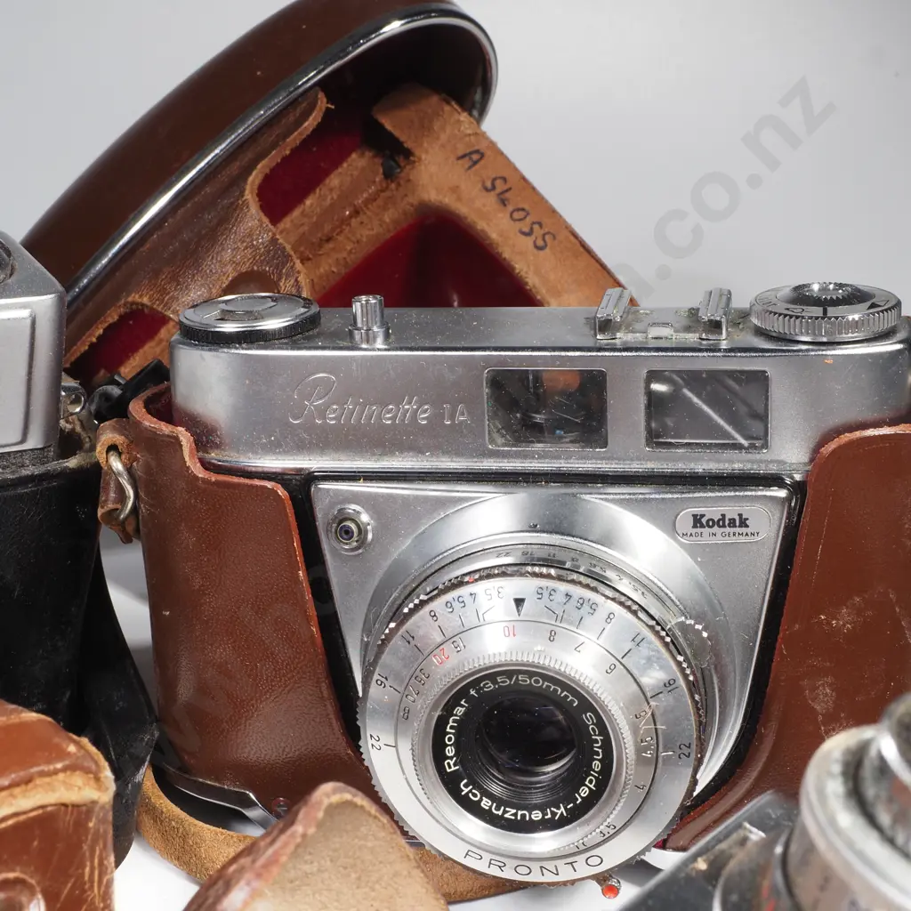 Four Vintage Cameras in Cases Image 1++