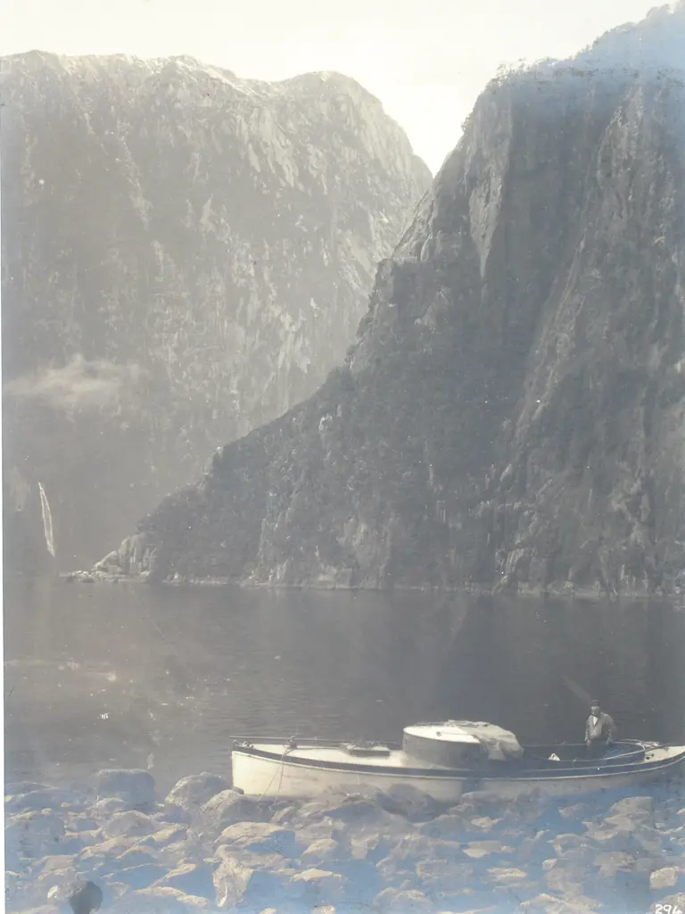 Photograph of Milford Sound & Stirling Falls with a Boat in the Foreground - c.1900 Image 1++