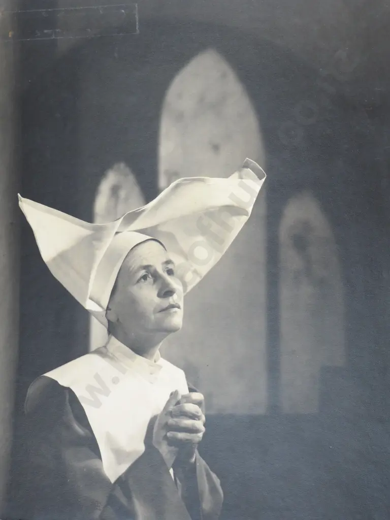 Photograph of a Nun in a Church Praying Image 1++