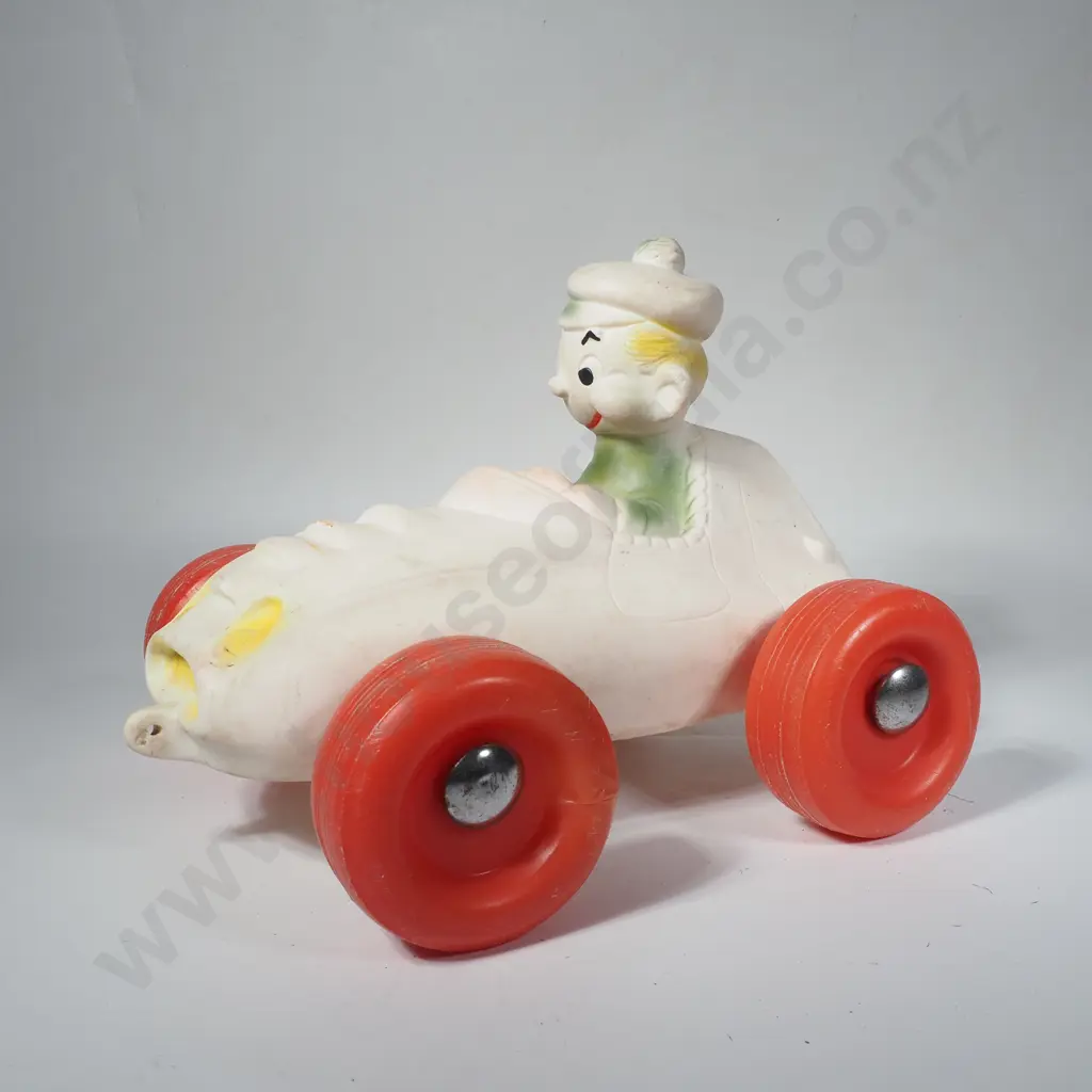 Vintage Moulded Rubber Squeaky Toy Featuring A Driver in a Racing Car Image 1++
