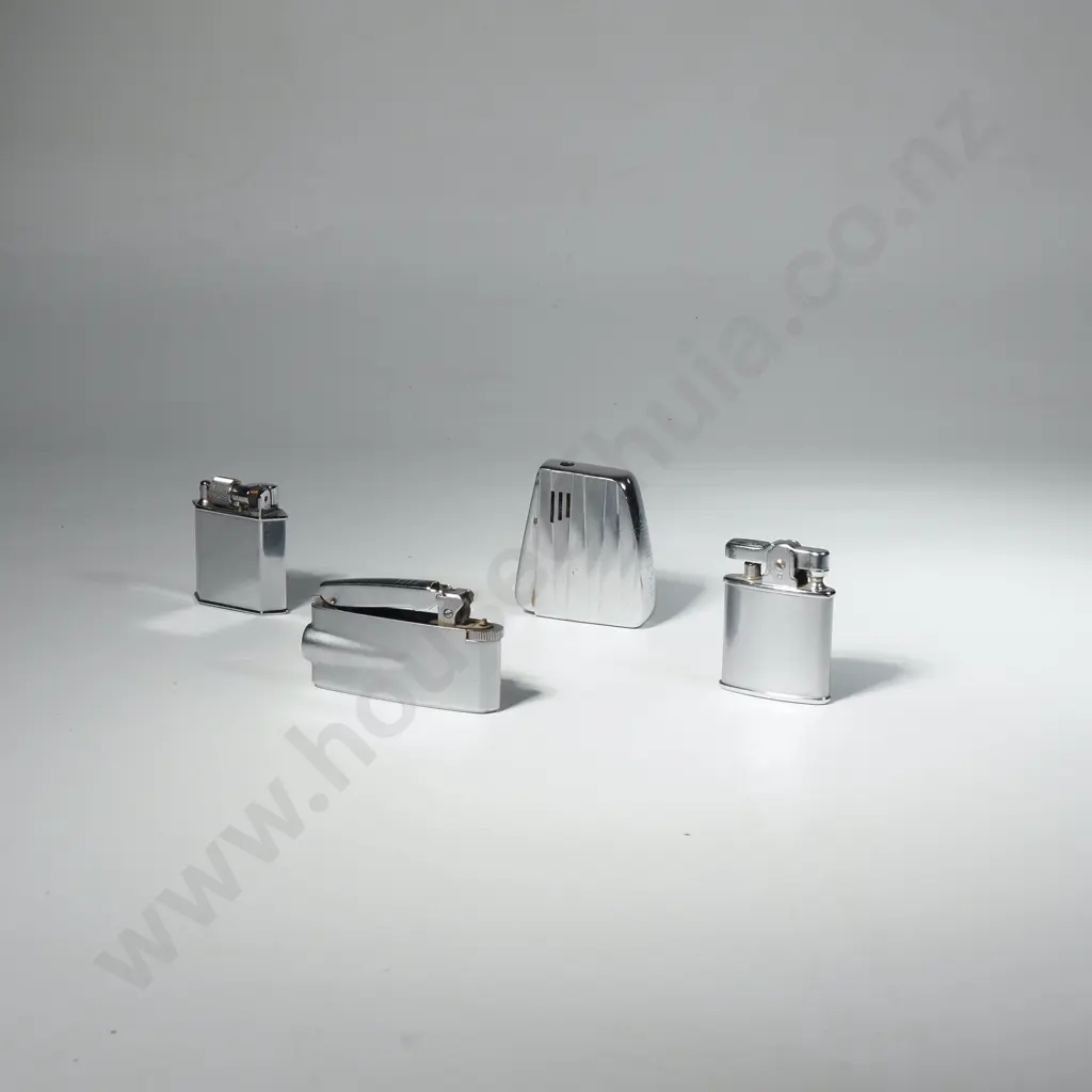 Four Vintage Stainless Steel Lighters. One w Air New Zealand Insignia Image 1++