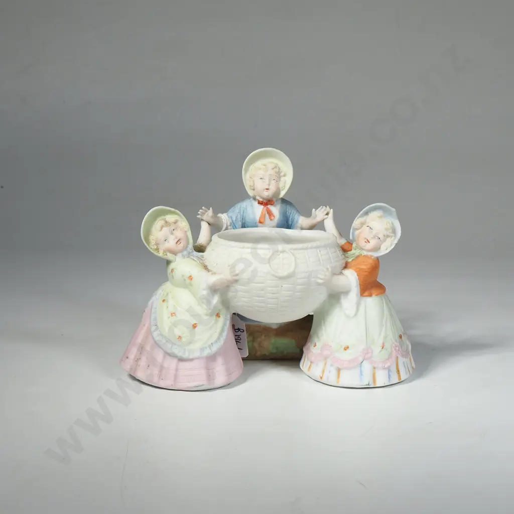 Antique German Small Bisque Figurine Depicting Three Children Holding a Basket Image 1++