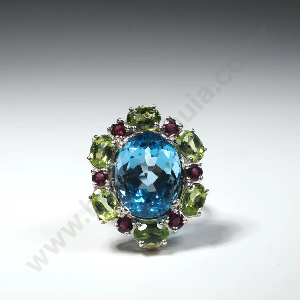 Sterling Silver Blue Topaz, Peridots and Garnet Ring Image 1++