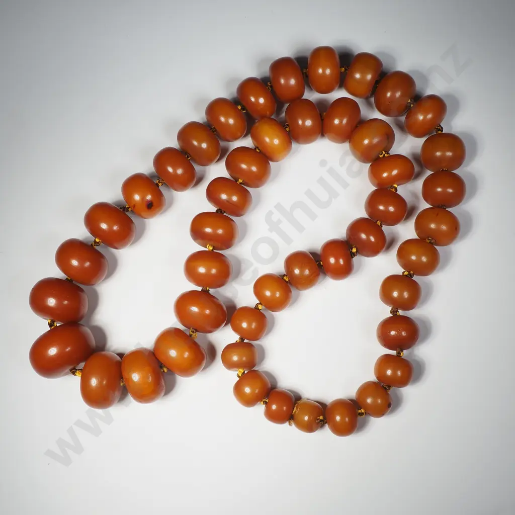 A Large String Of Graduated Amber Coloured  Beads Image 1++