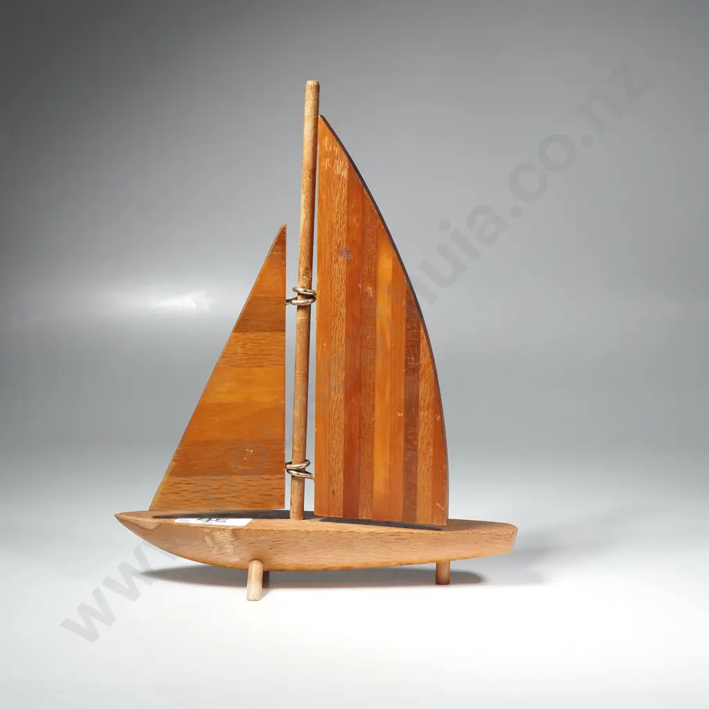 Wooden Ornamental Sail Boat with Three Feet Under The Hull. Each Sail is Made from Vertical Strips of Wood Image 1++