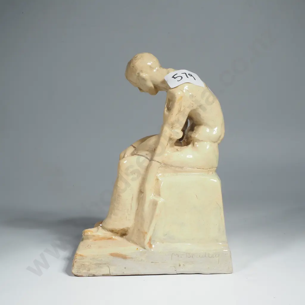 M Bradley, Seated Figure w Spade, Pottery Image 1++