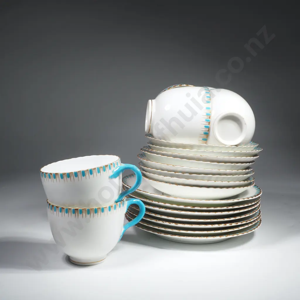 Early Porcelain Tea Set w Six Cups, Eight Saucers & Seven Cake Plates, Turquoise & Gilt Border on a White Ground Image 1++