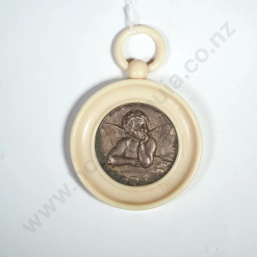 Ivorex Circular Frame Inset With A Cupid Figure. Marked Lourdes Verso. Possibly A Cradle Protector. Image 1++