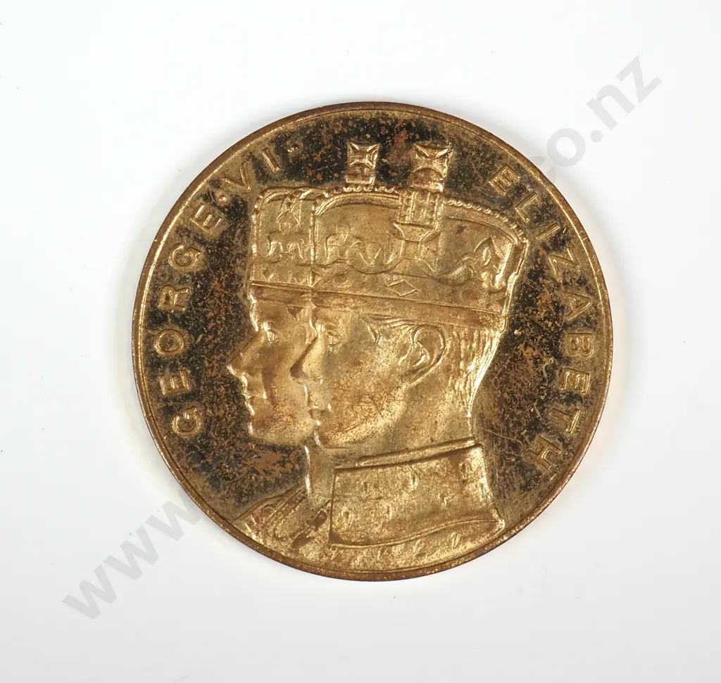 Gilt medal struck  to commemorate the proposed Royal visit of King George VI and Queen Elizabeth in 1949. 35mm. It is listed in the Catalogue of New Zealand Commemorative Medals 1941-2007 by Hamish MacMaster as number 1949/3 and is very rare Image 1++