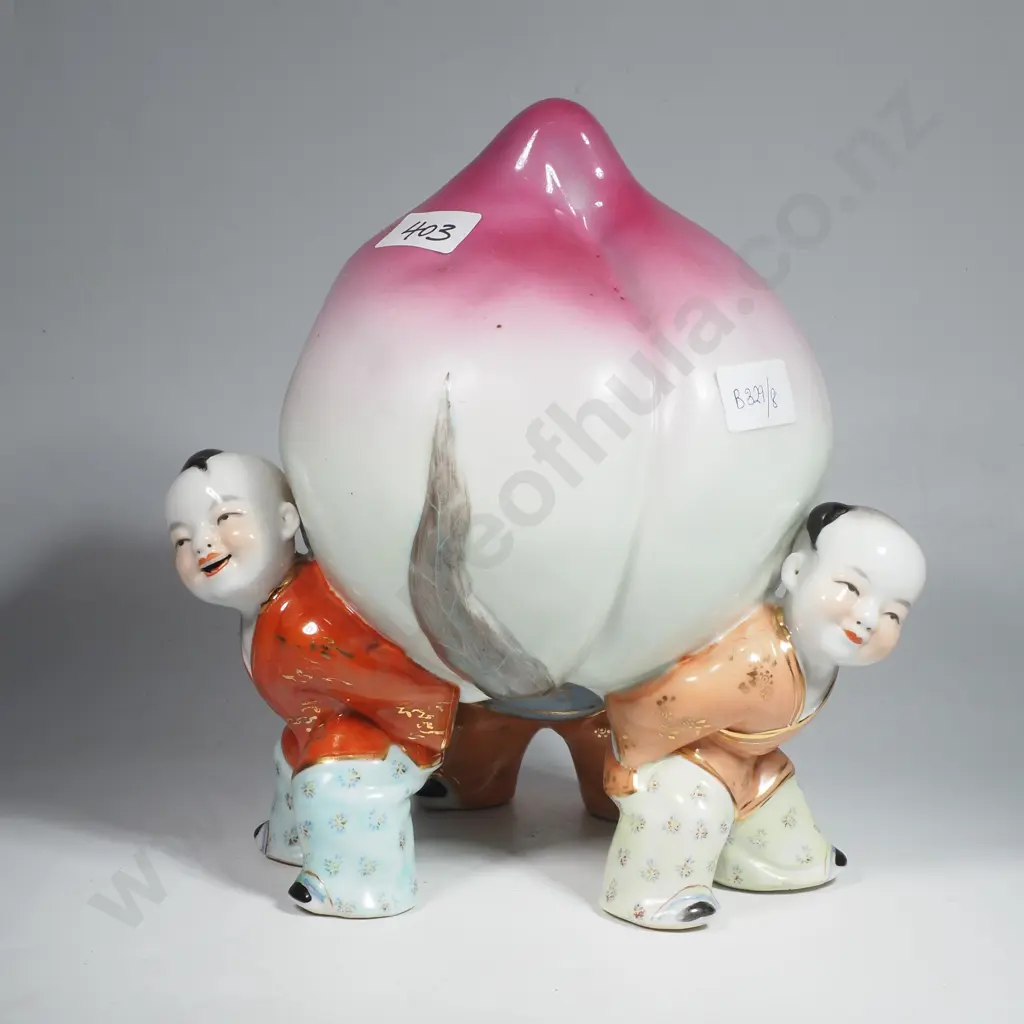 Chinese Porcelain Figurine Depicting three Children Holding Up a Long Pink Longevity Peach Image 1++