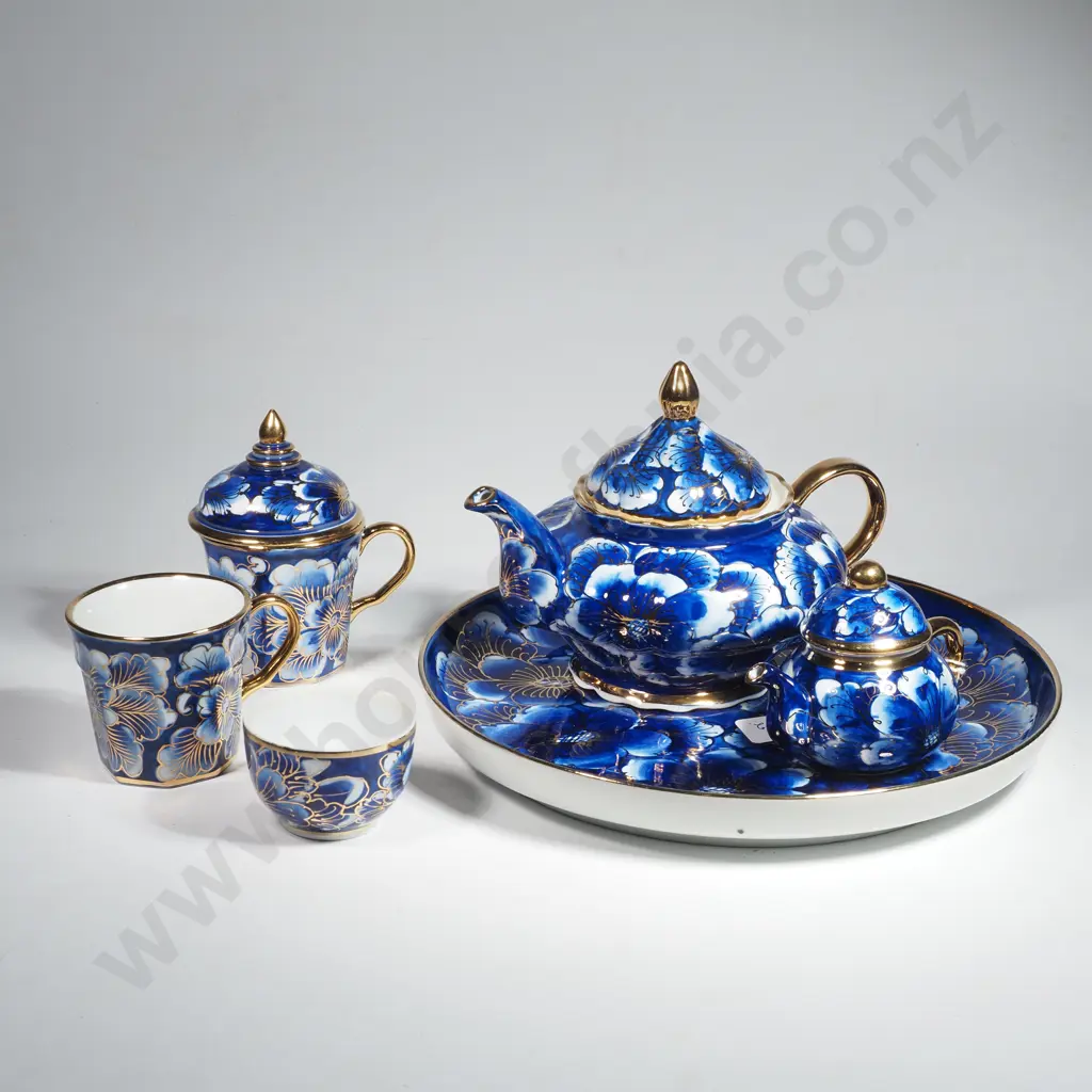 Collection of Blue & White China w Gilt Enhancements including a Teapot, Sugar Bowl & Cream Jug, Two Cups & a Round Tray Image 1++