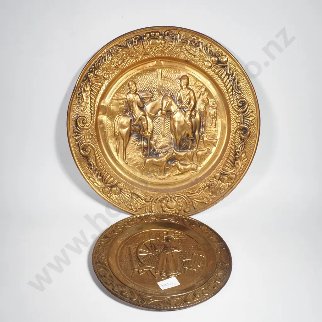 Two Brass Wall Plaques w Embossed Scenes - The Smaller w Welshwoman at a Spinning Wheel & the Other w a Hunting Scene Image 1++